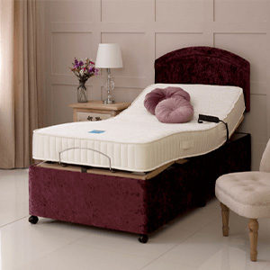 an electric adjustable bed in red with the mattress profiling