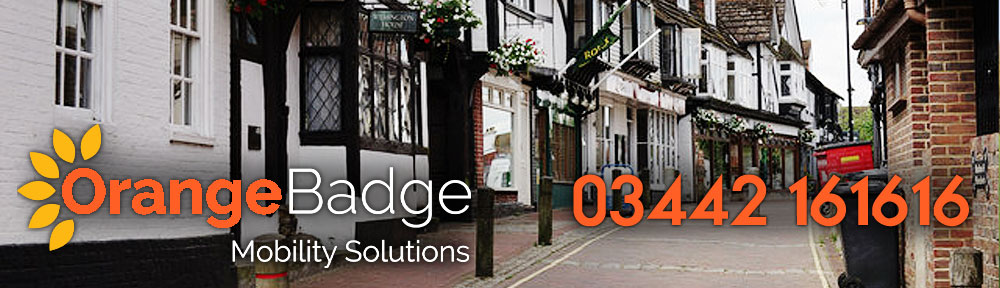 Picture of East Grinstead High Street with Orange Badge Mobility logo and 03442 161616 number