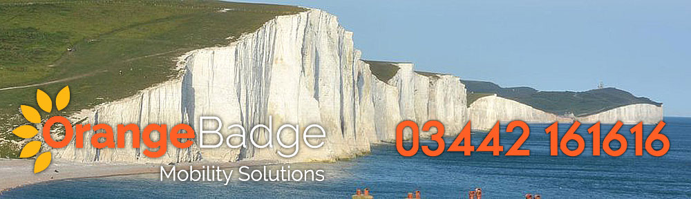 picture of the seven sisters chalk cliffs in east sussex with orange badge mobility logo and 03442 161616 number