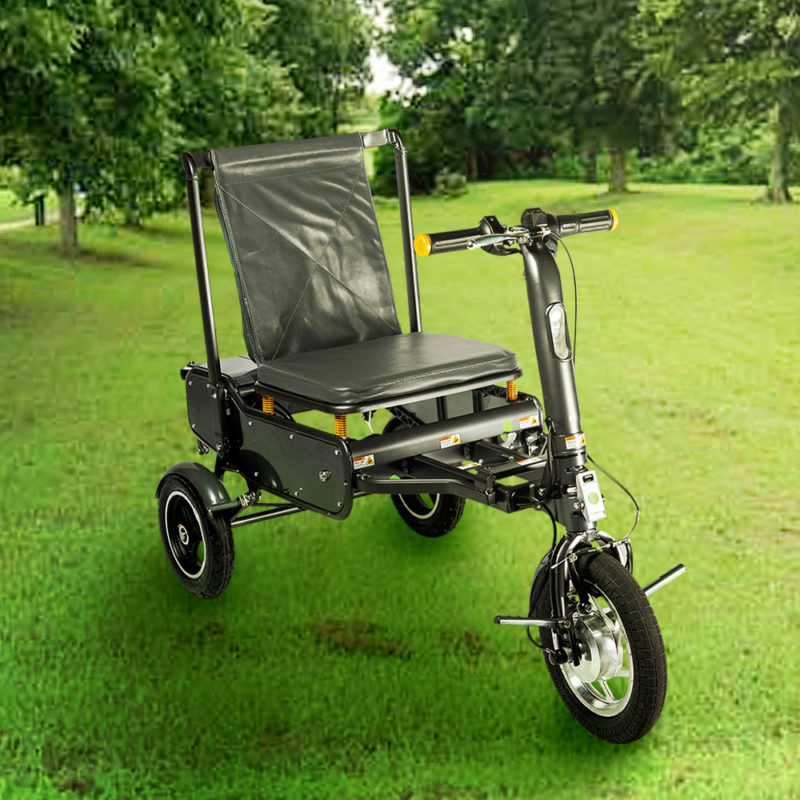 an efoldi mobility scooter sits on grass at a park in east Sussex