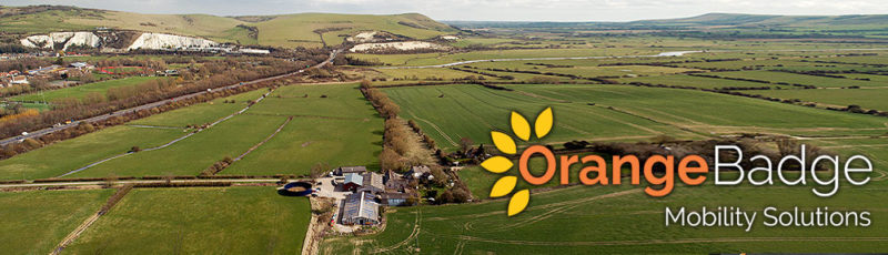 aerial drone view of orange badge mobility with logo